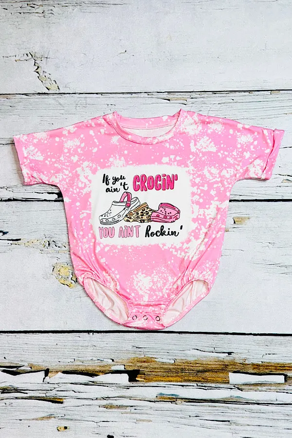 "IF YOU AIN'T CROCIN' YOU AINT ROCKIN" bleached light pink bubble romper
